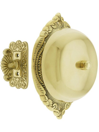 Transitional Victorian Mechanical Door Bell in Polished Brass.